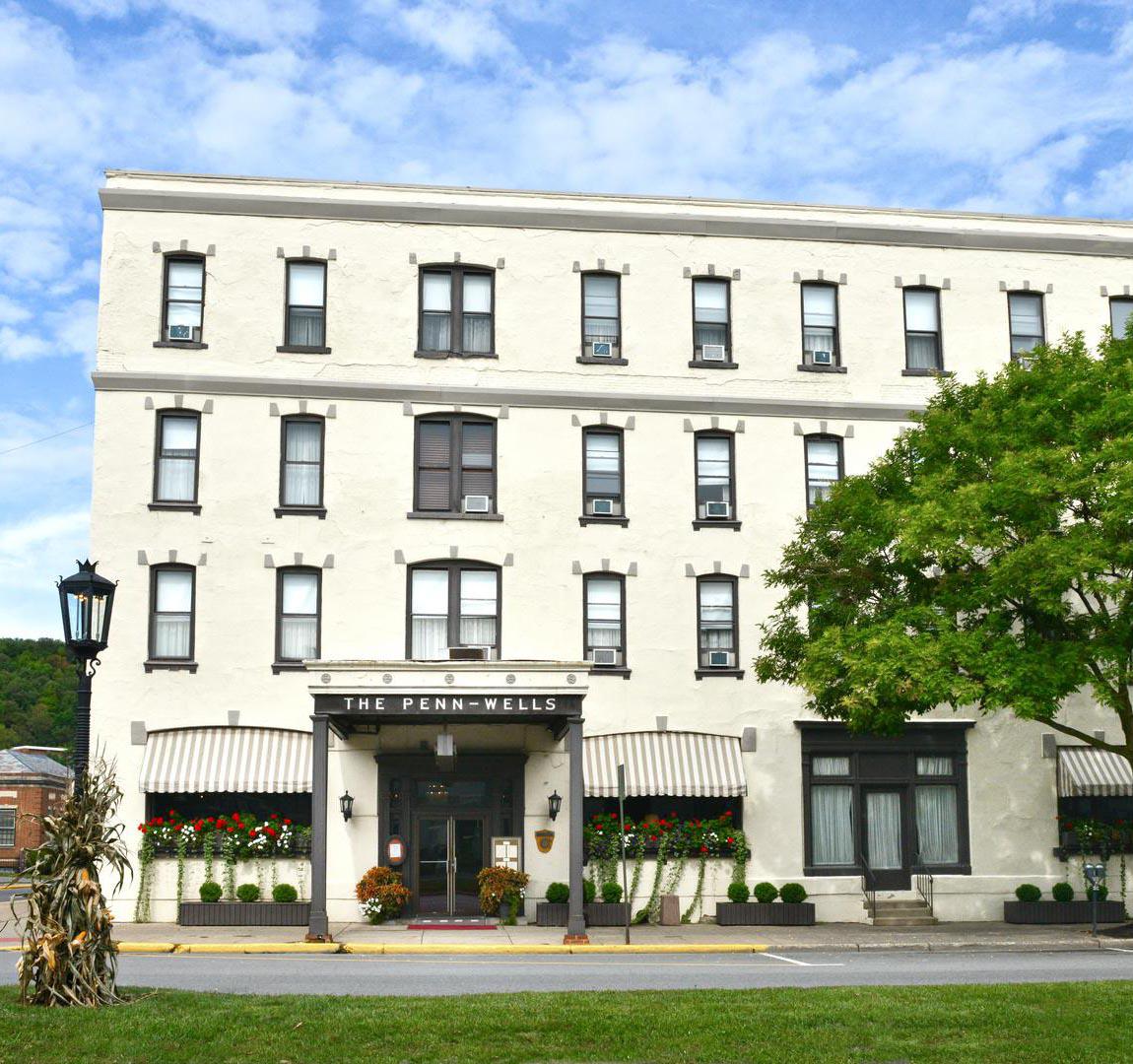 a building with a tree in front