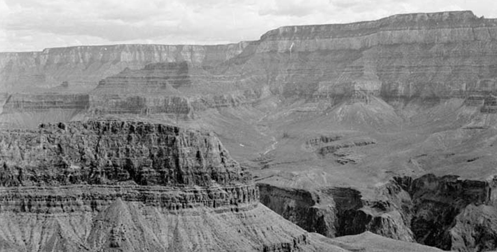 a large canyon with a steep cliff