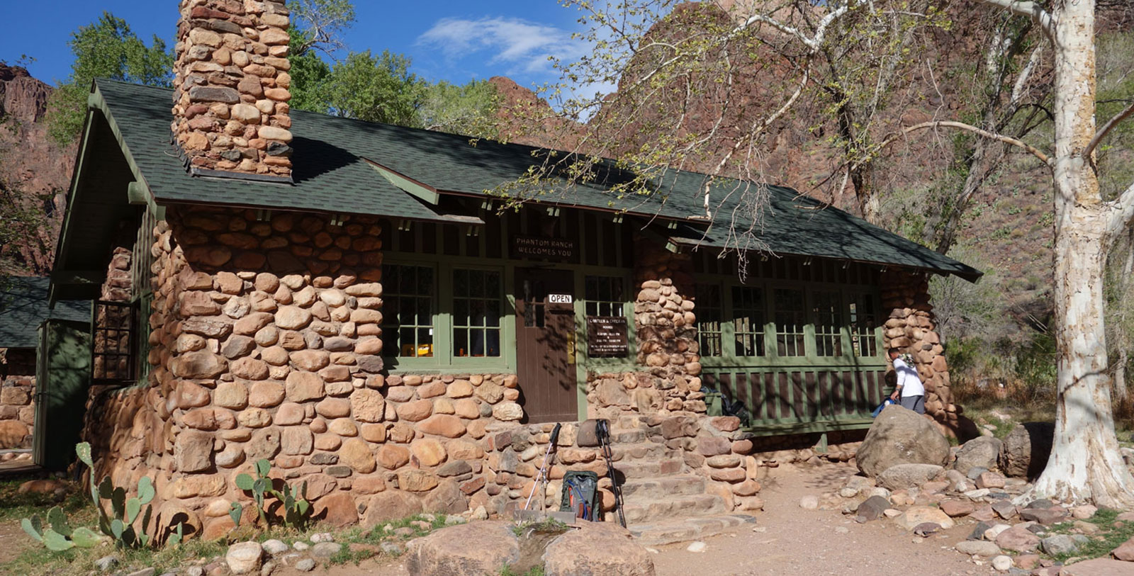 a building with a green door and a green roof