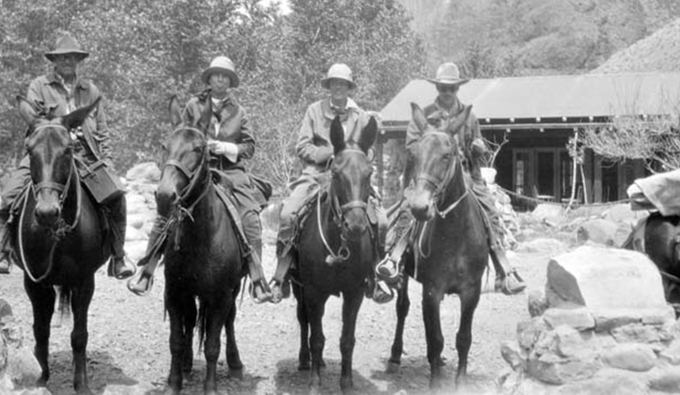 a group of people riding horses