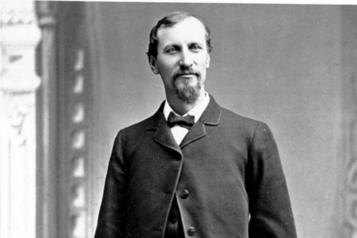 a man in a suit and bow tie