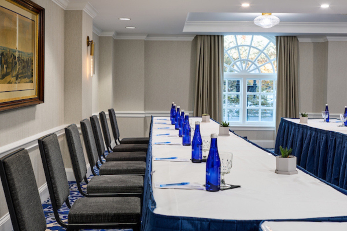 a long table with blue bottles on it