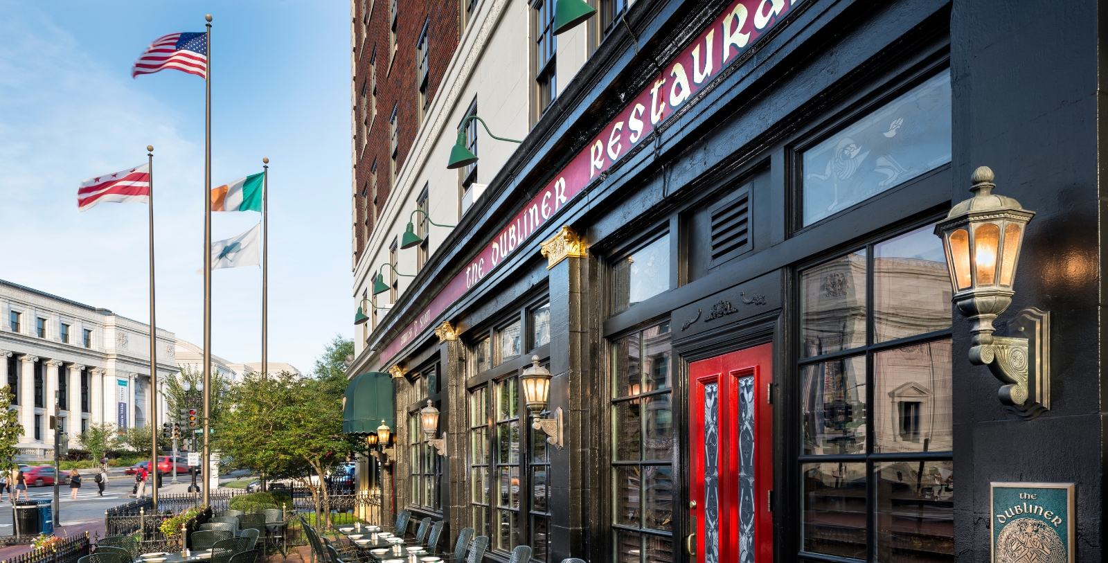 a restaurant with tables and chairs outside