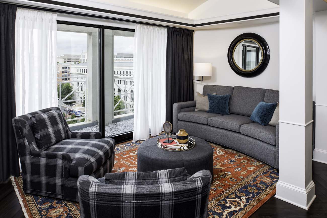 a living room with a couch and a round table