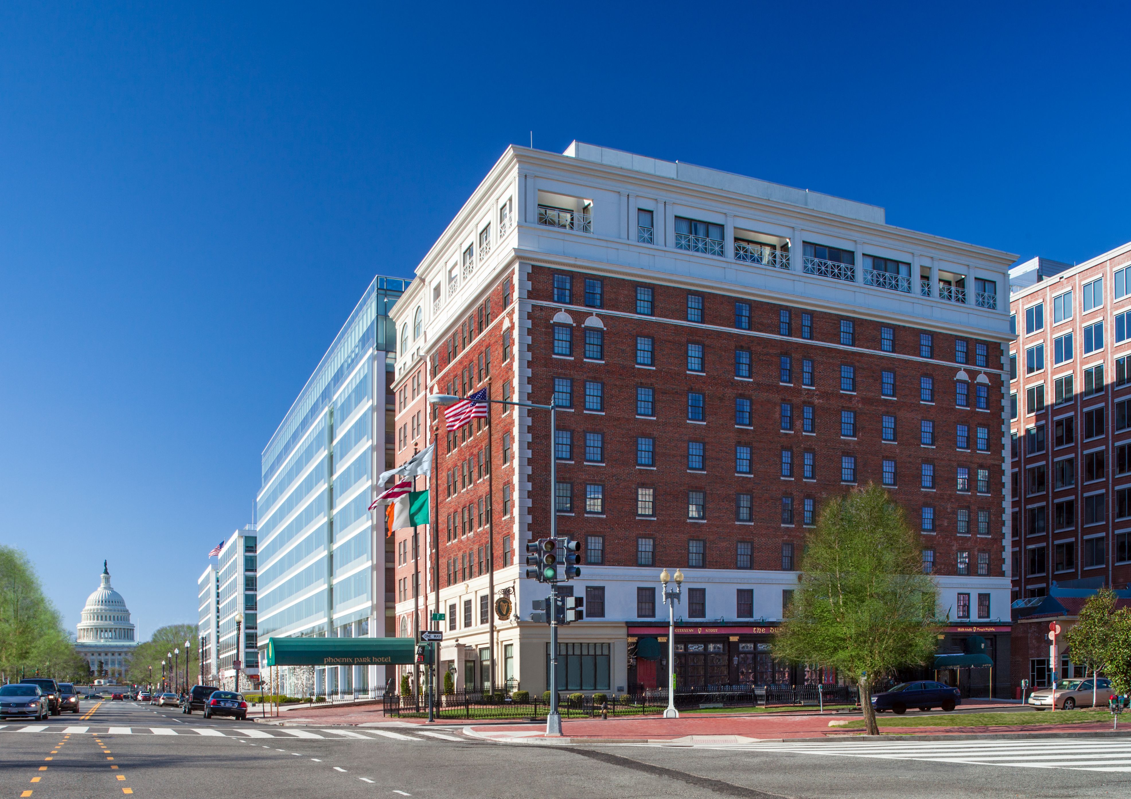 a large brick building with flags on the side of it