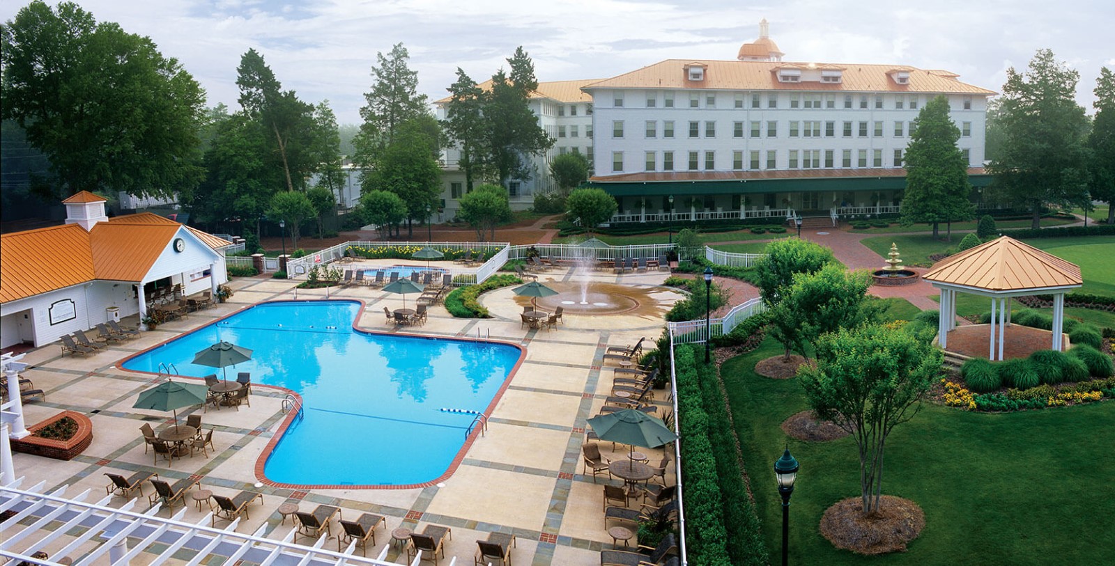 a pool and a fountain in a hotel