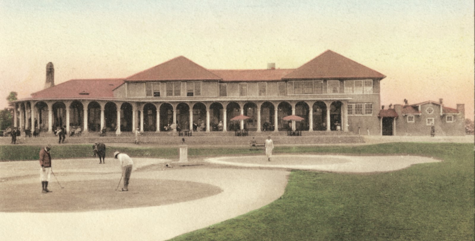 a building with columns and a golf course