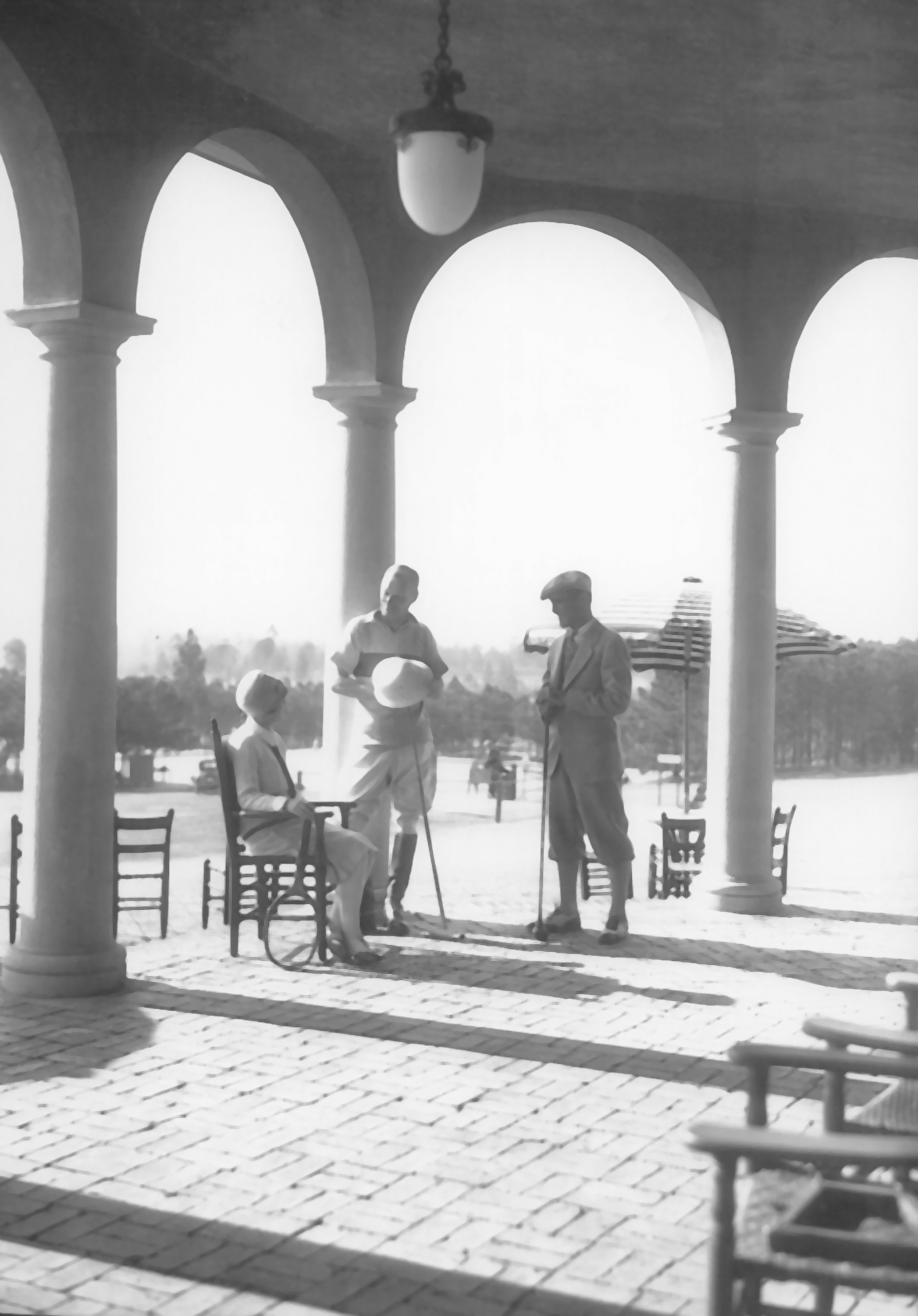 a group of people standing under a large archway