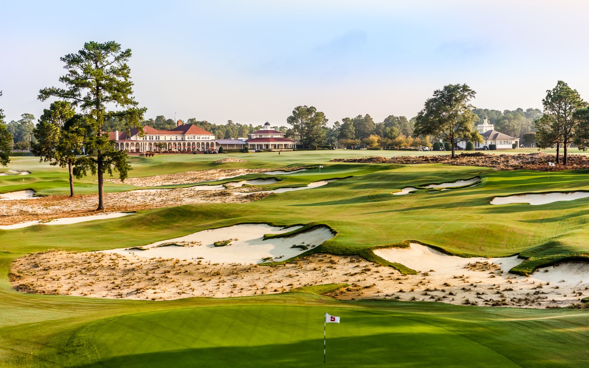 a golf course with a flag on the ground