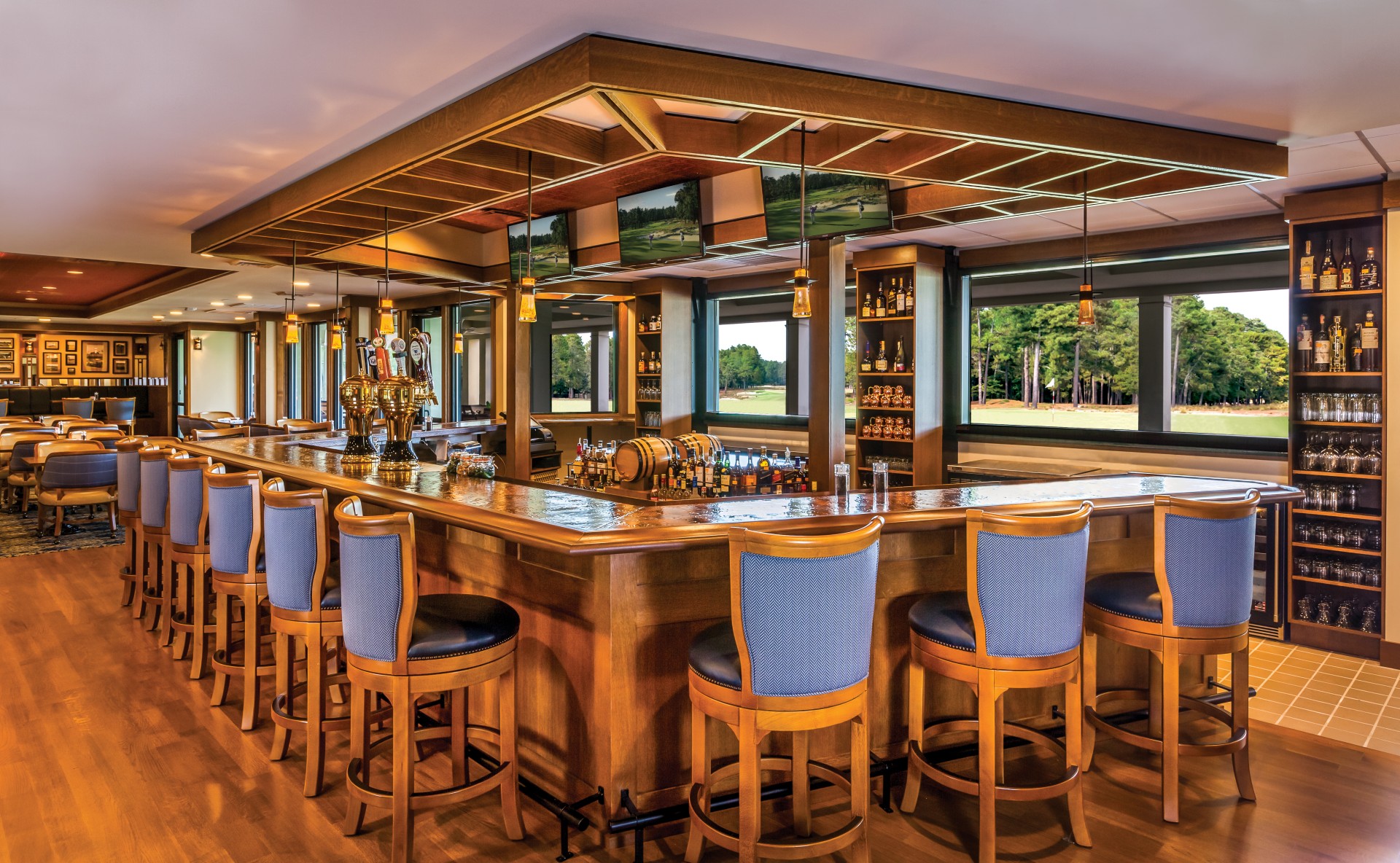 a bar with chairs and a large counter