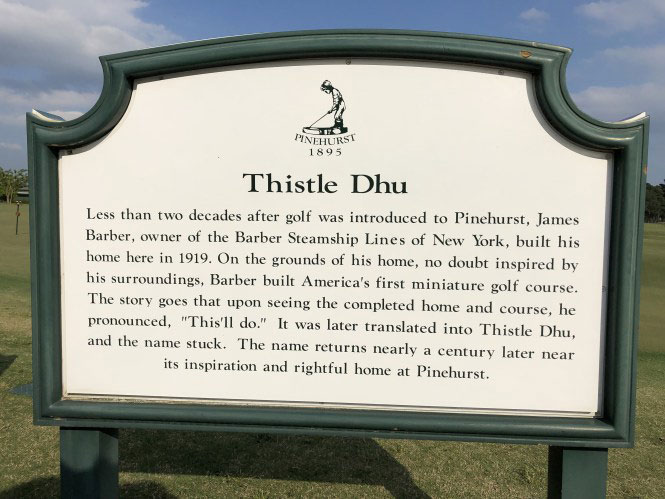 a sign on a green post