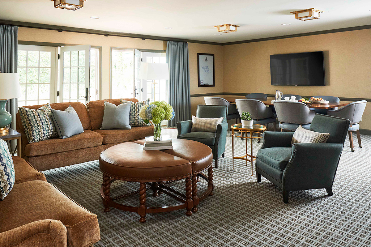 a living room with a couch and chairs