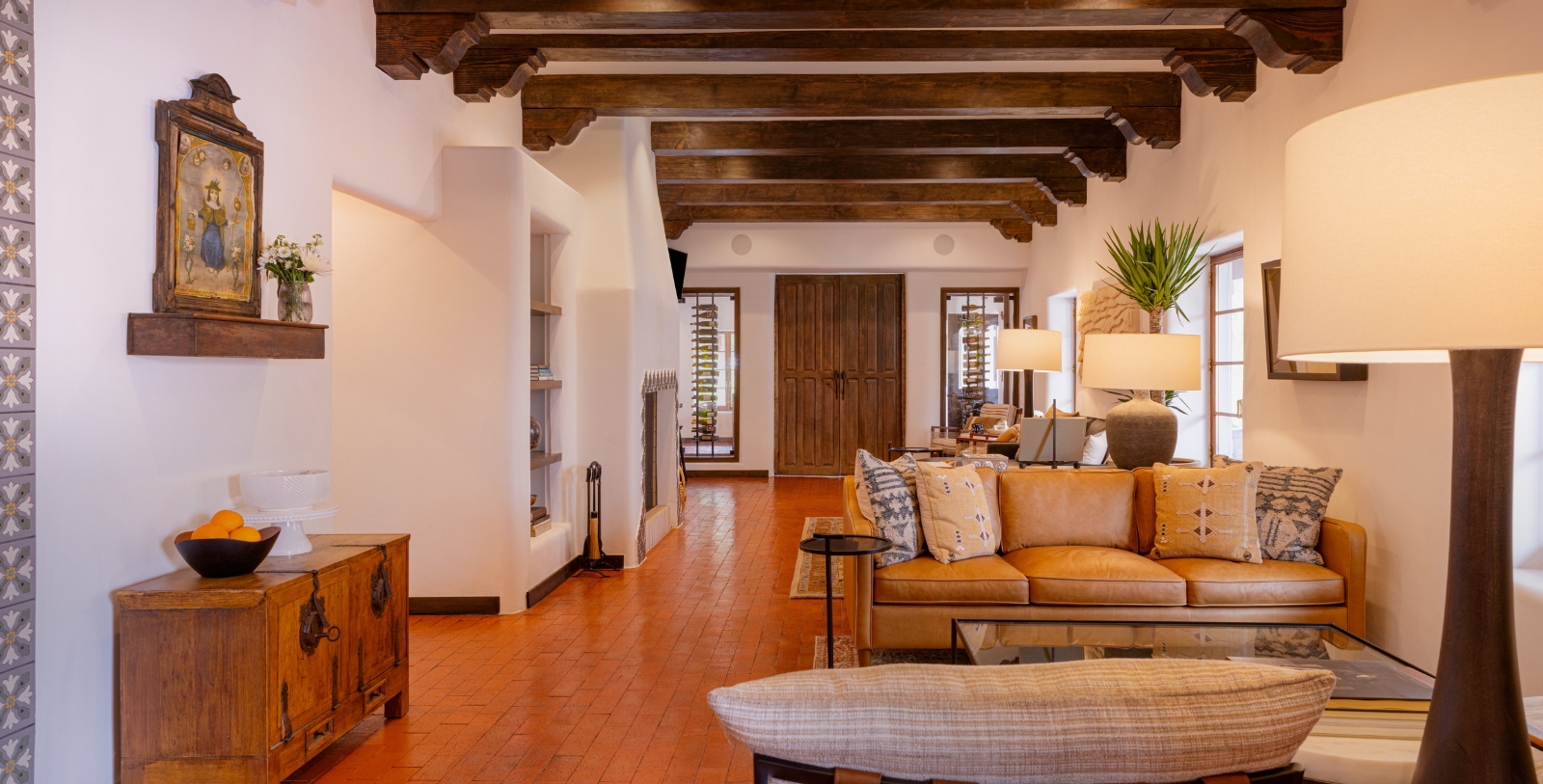 a living room with a couch and a fireplace