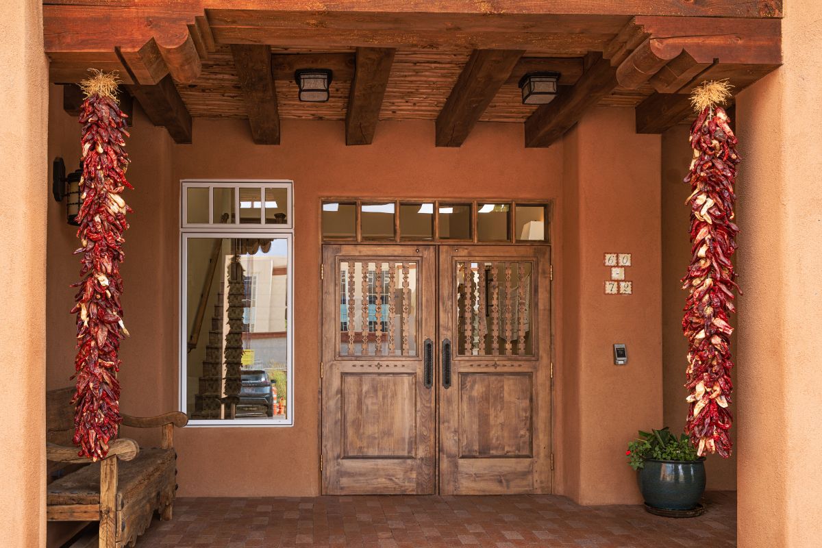 a brown building with a wooden door