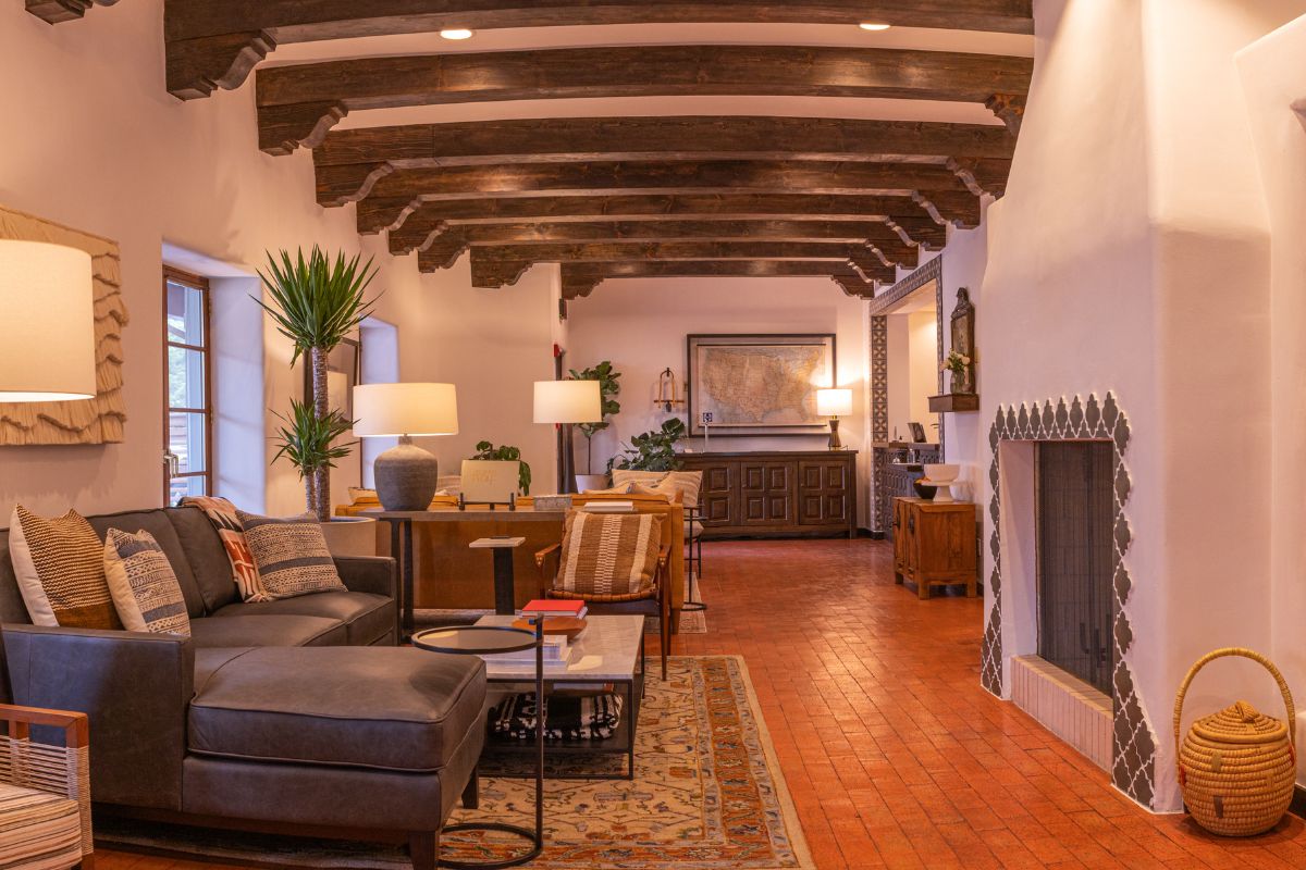 a living room with a fireplace and couches