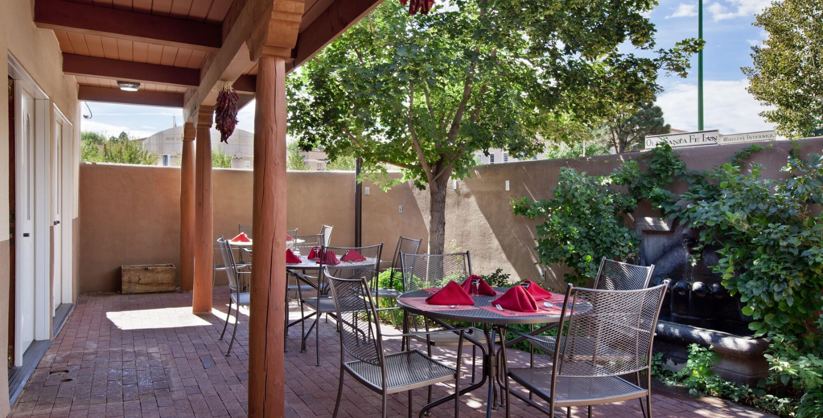 a patio with tables and chairs