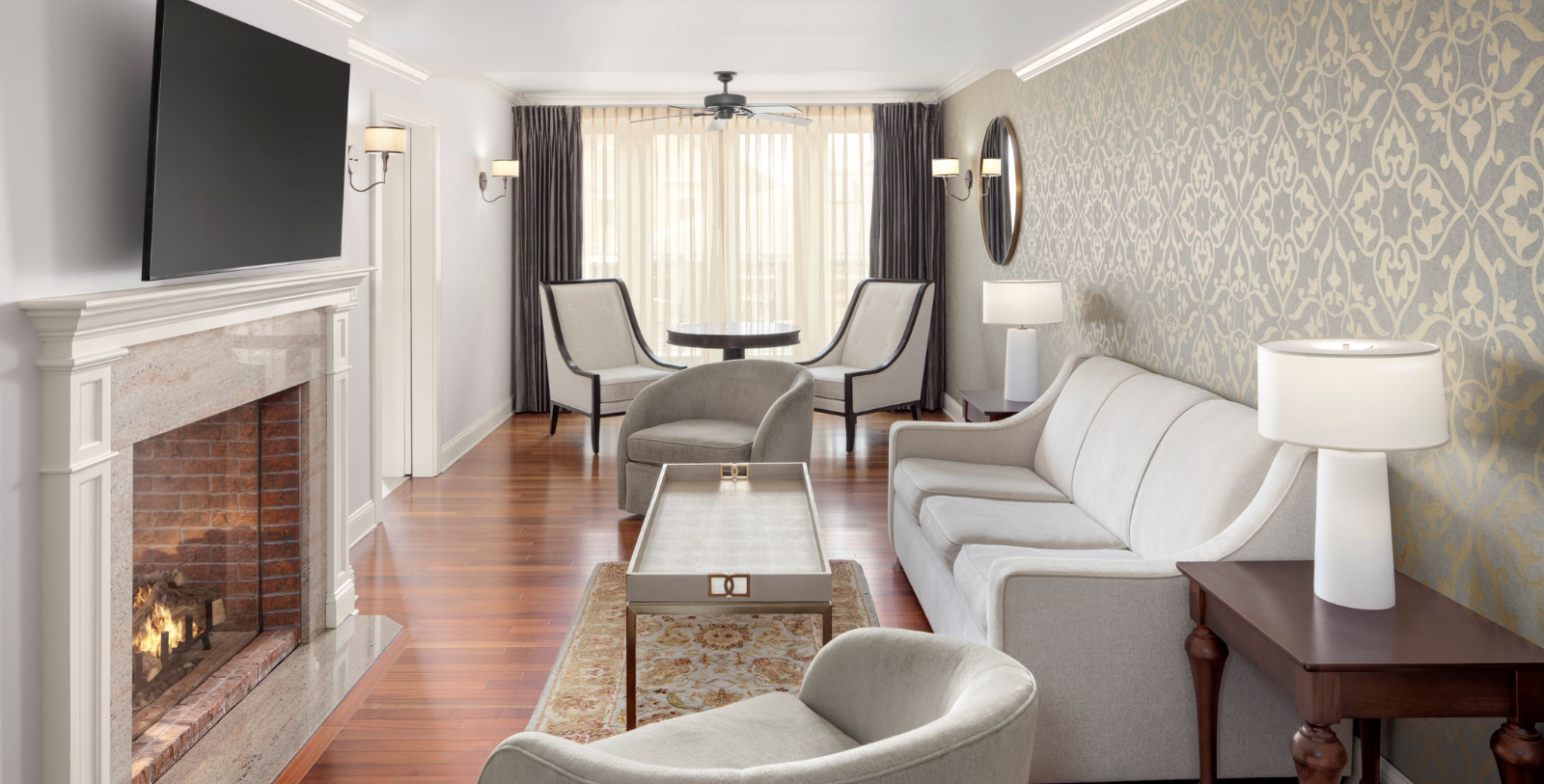 a living room with a couch and chairs