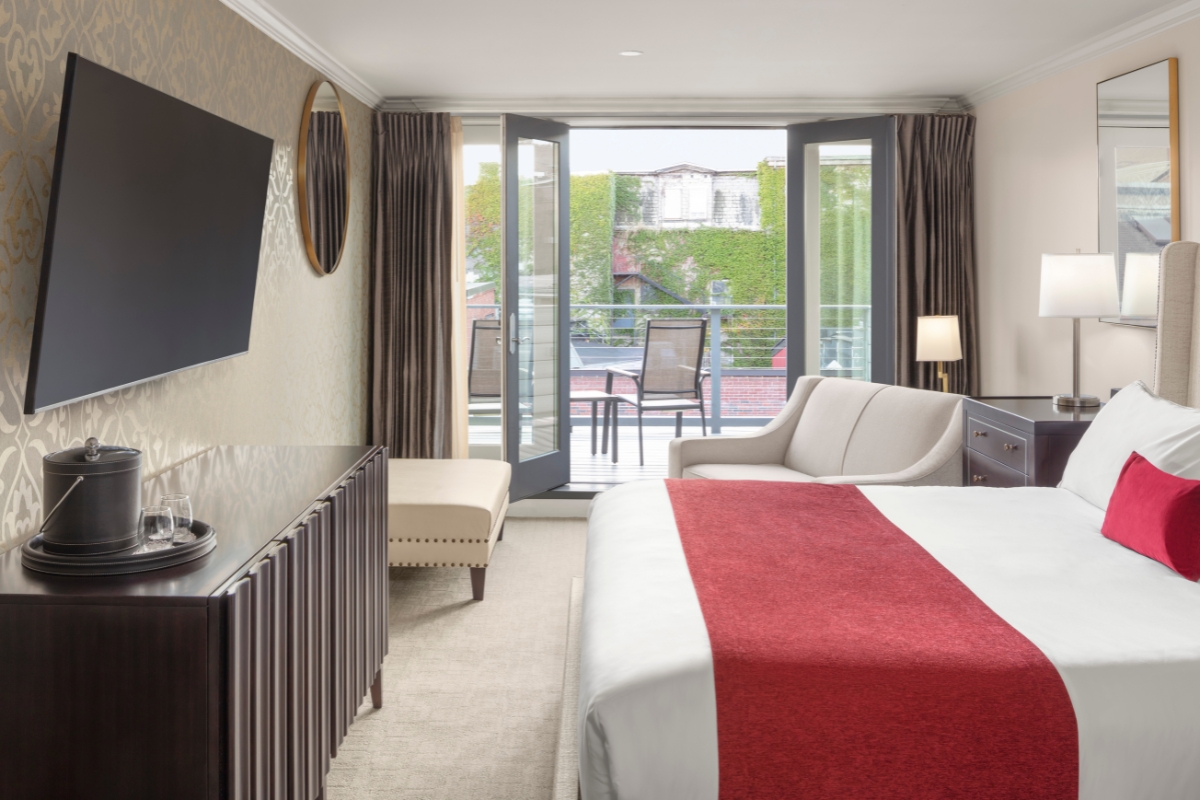 a room with a bed and a television