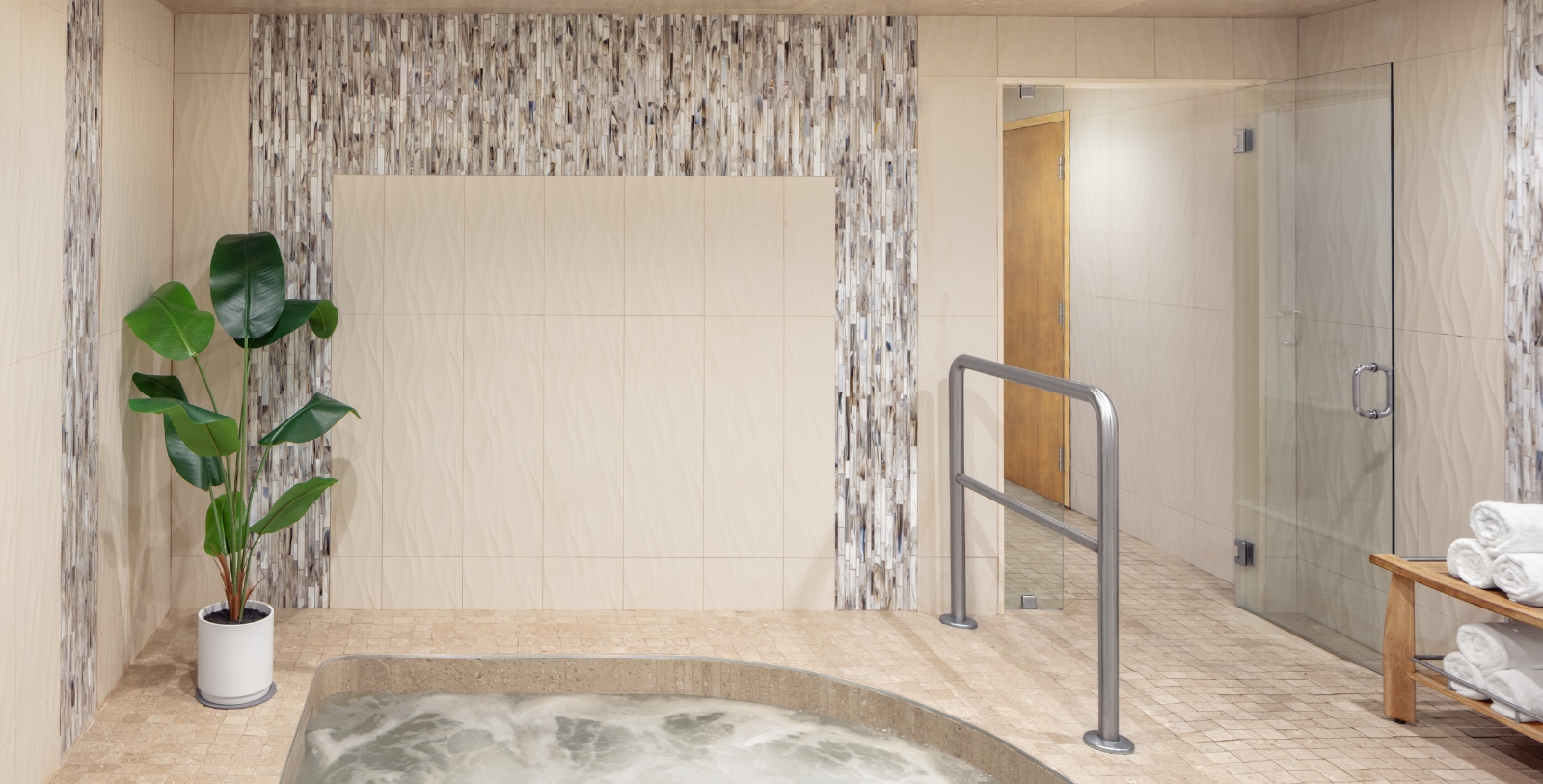 a room with a jacuzzi tub and a door