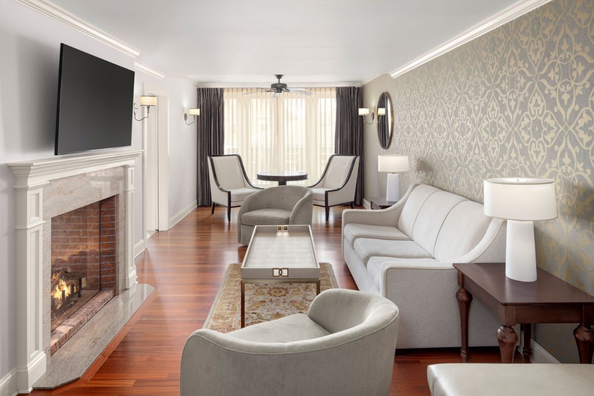 a living room with a fireplace and couches