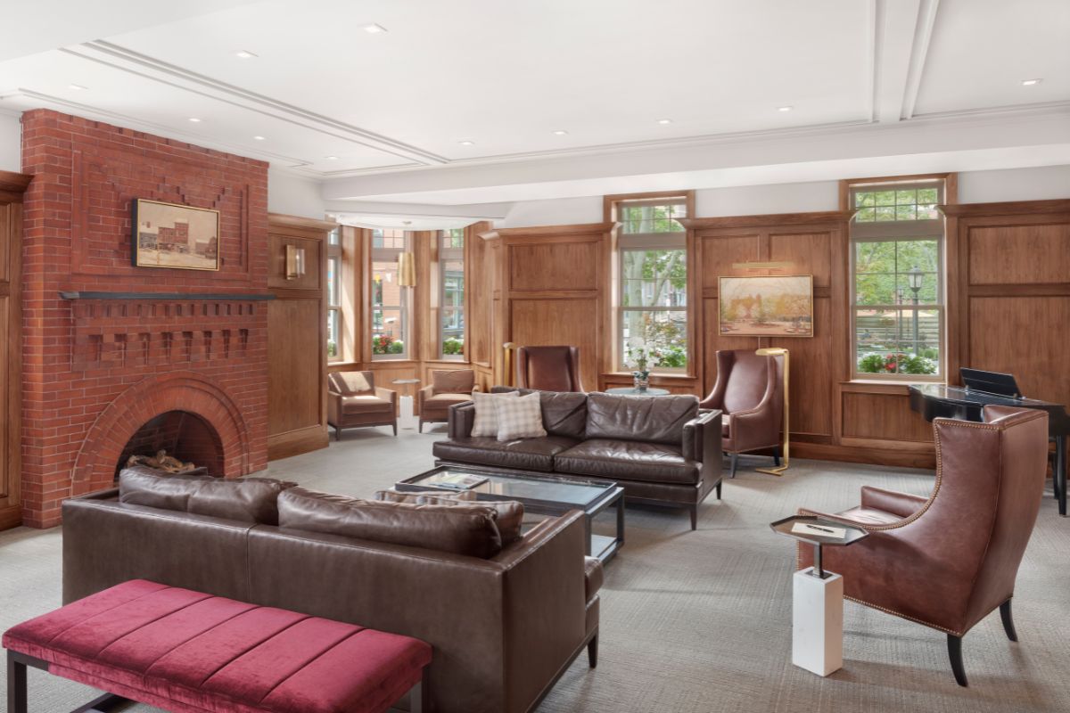 a room with a fireplace and couches