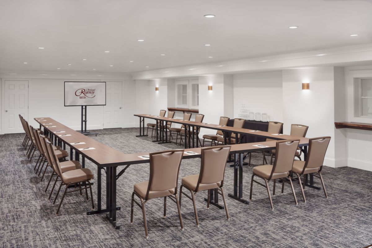 a room with a large table and chairs