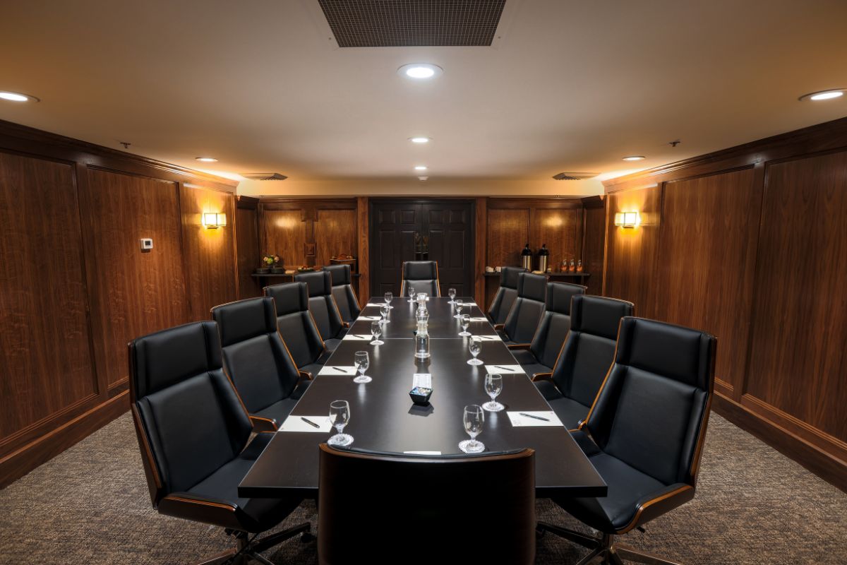 a conference room with a table and chairs