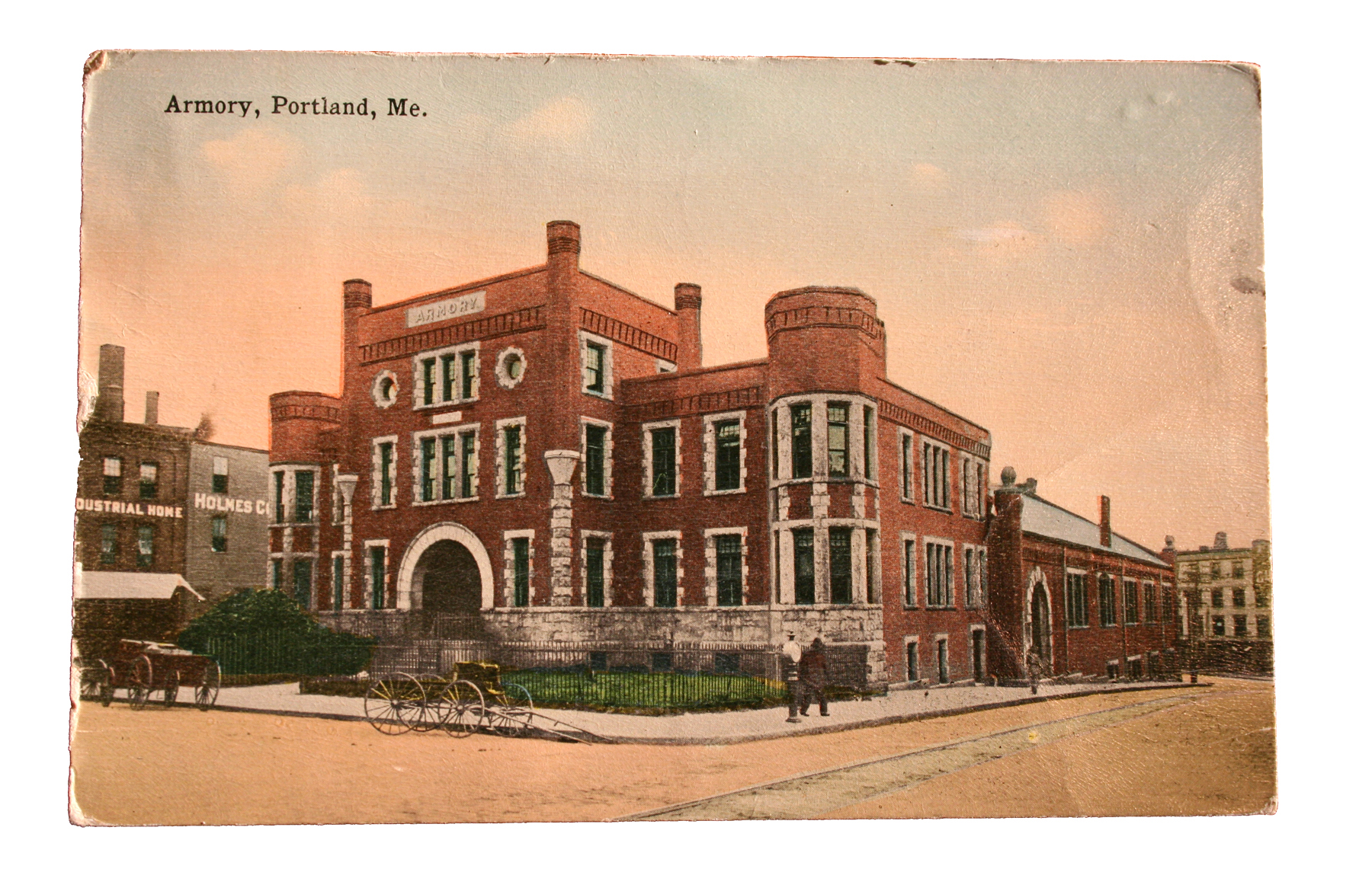 a brick building with a fence and a bicycle parked on the side