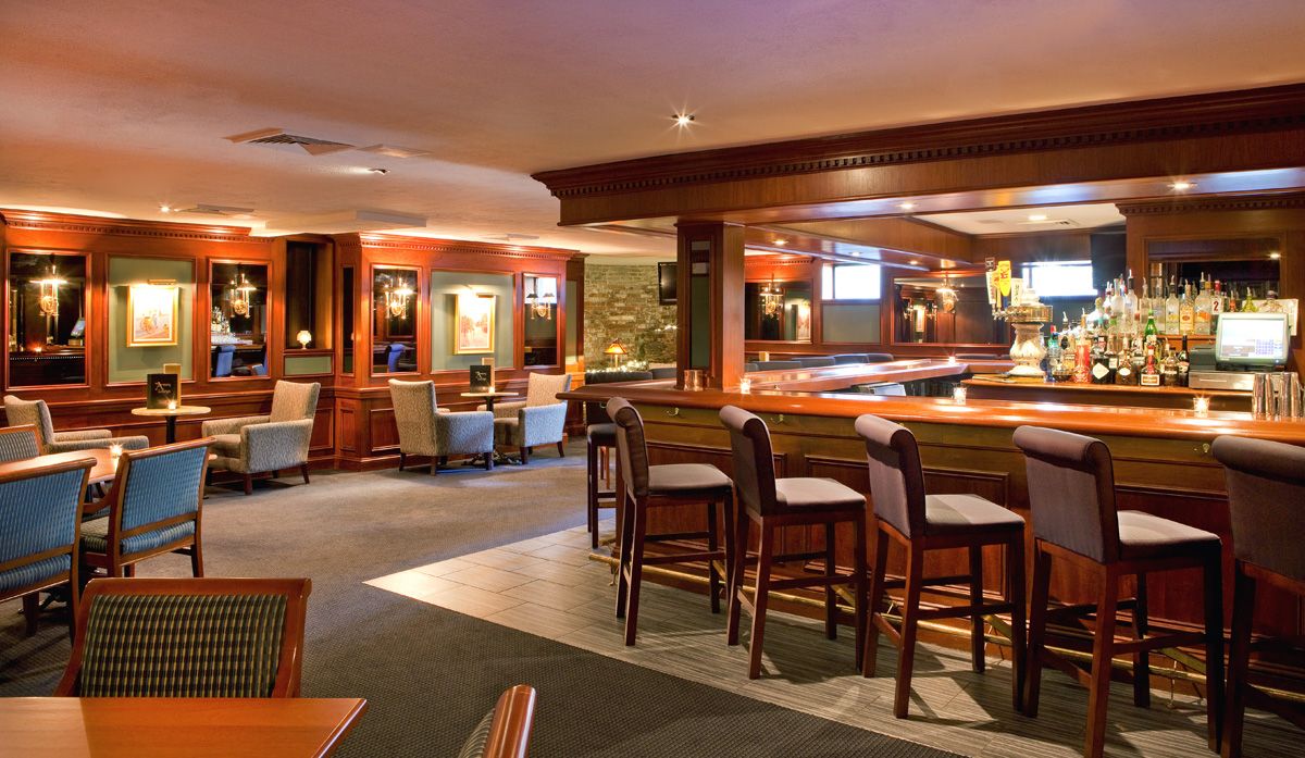 a bar with chairs and tables