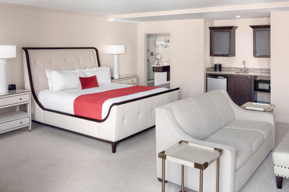 a bedroom with a bed and a couch