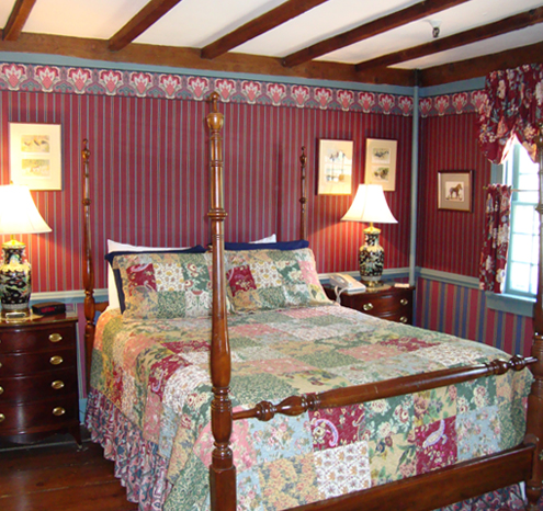 a bed with a four poster bed