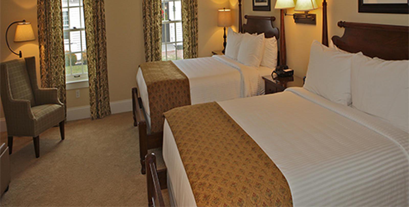a hotel room with two beds