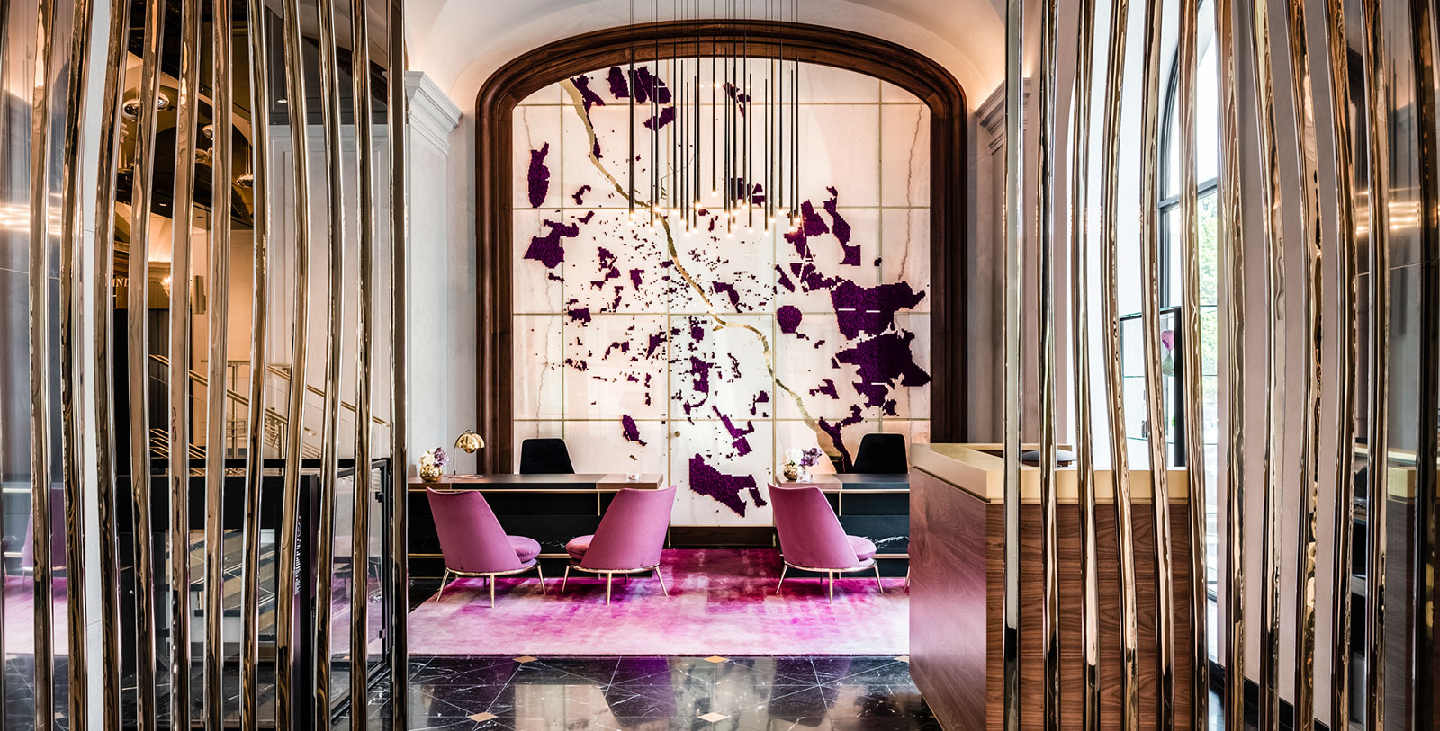 a room with purple chairs and a table
