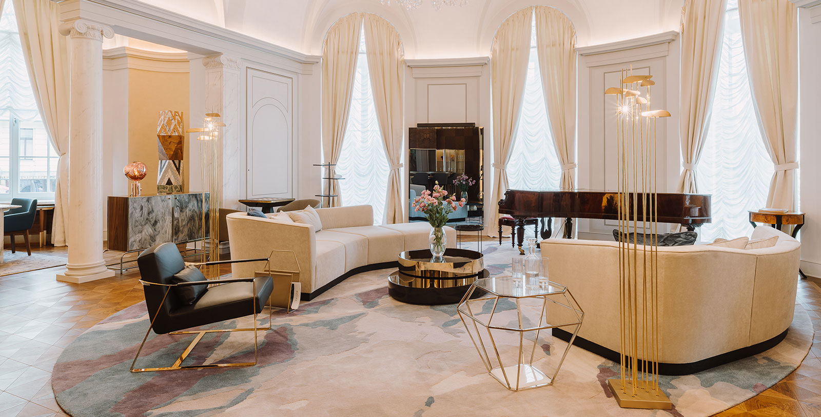 a room with a piano and couches