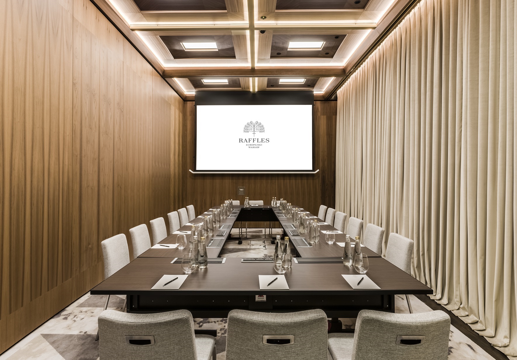 a conference room with a large table and chairs