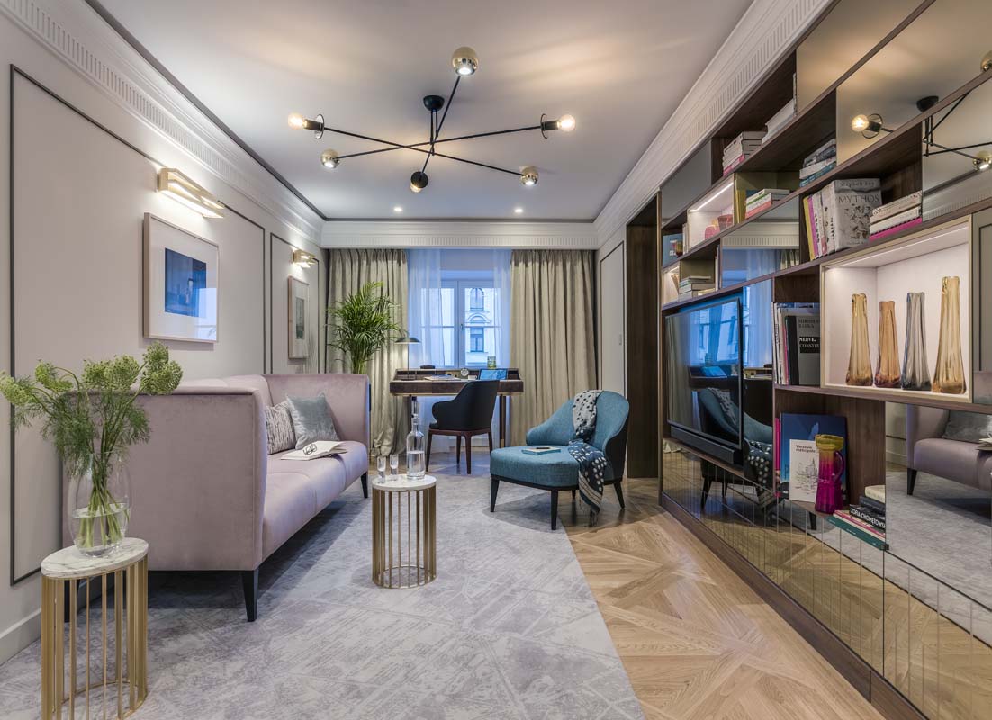 a living room with a couch and a desk