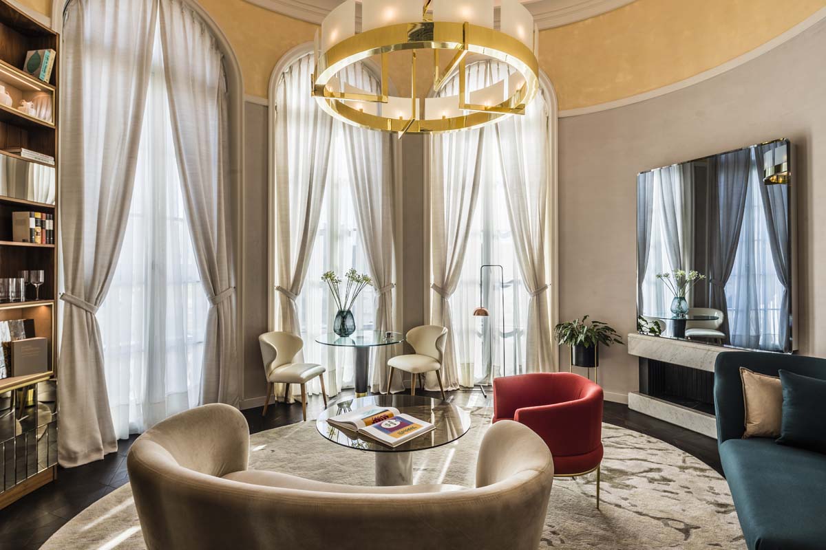a room with a round table and chairs