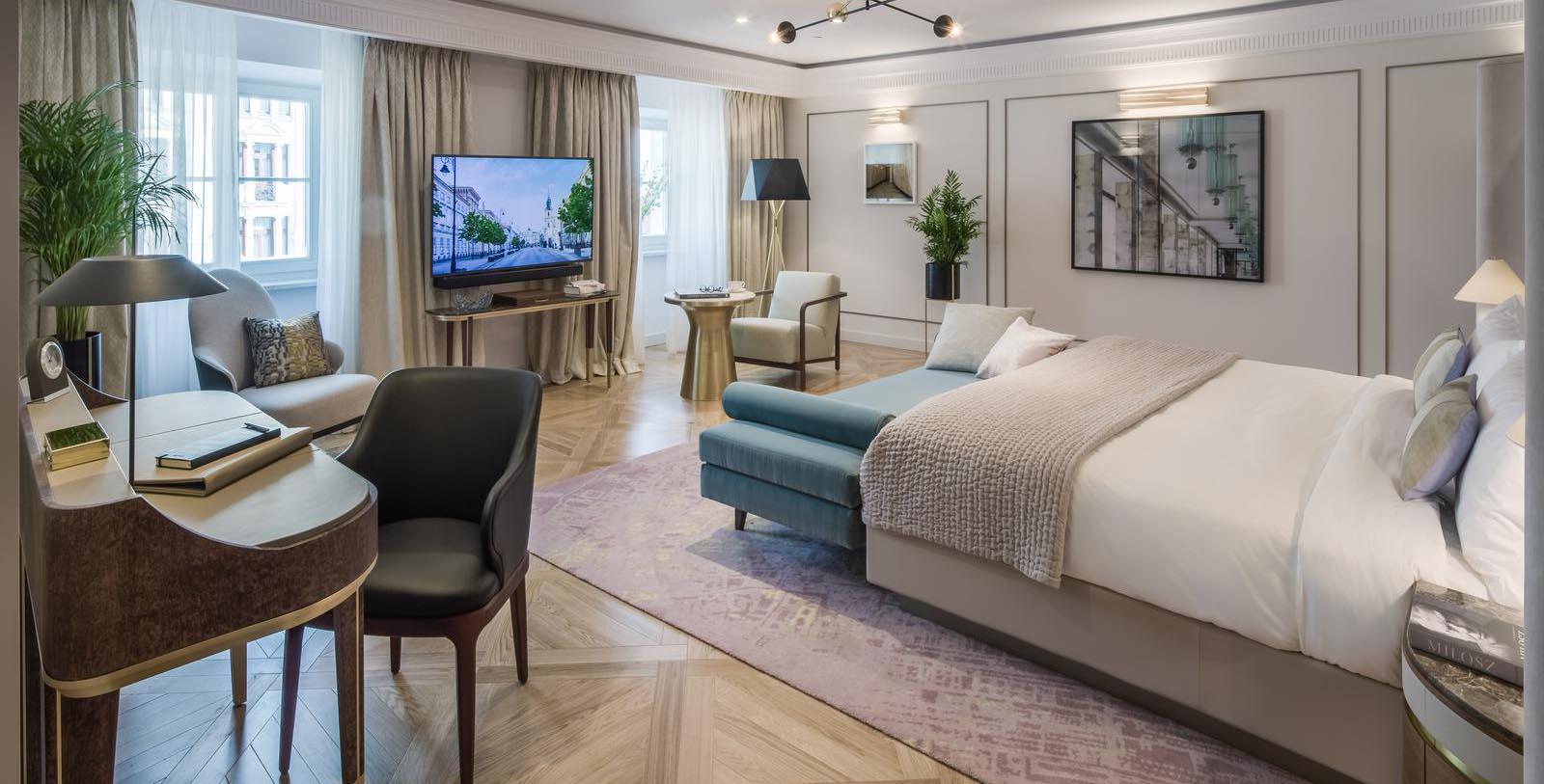 a bedroom with a bed and a television
