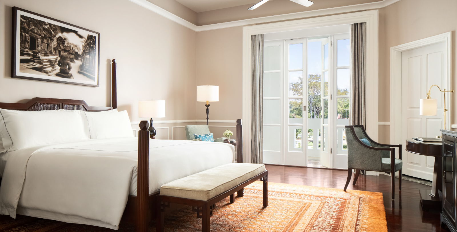 a bedroom with a bed and a rug