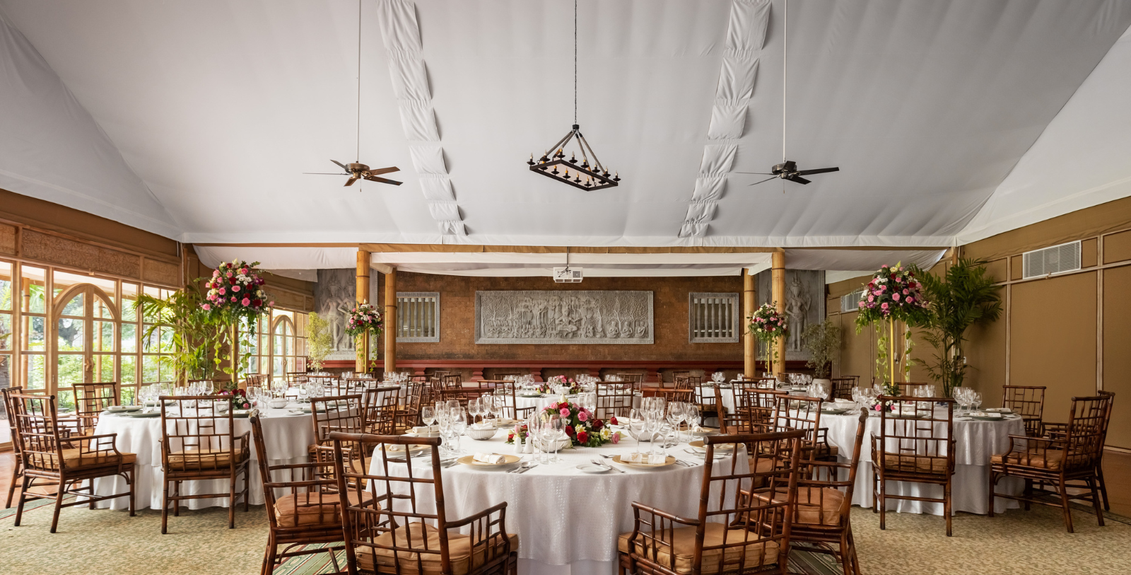 a large round table set for a wedding reception
