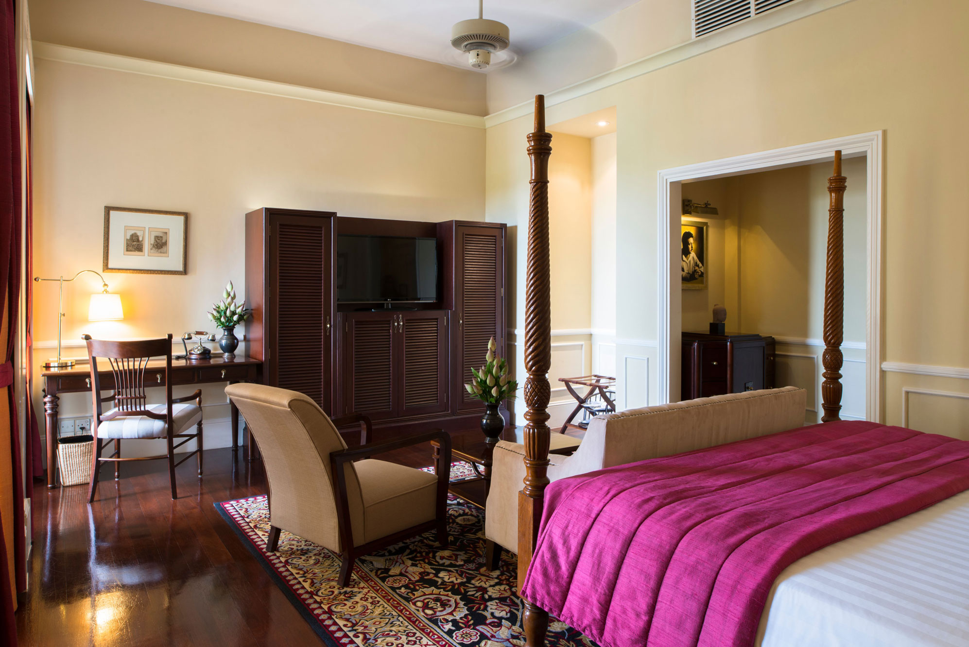 a bedroom with a bed and a television