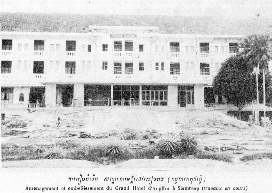 a large white building with many balconies