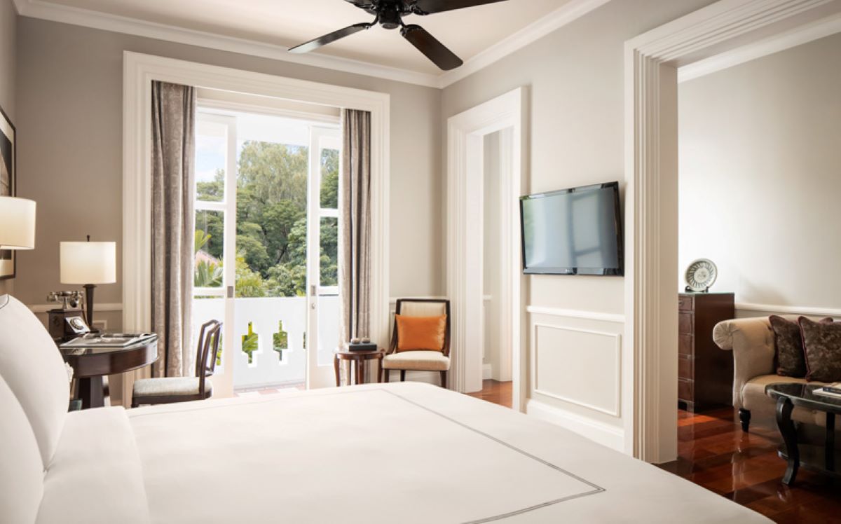 a room with a bed and a television