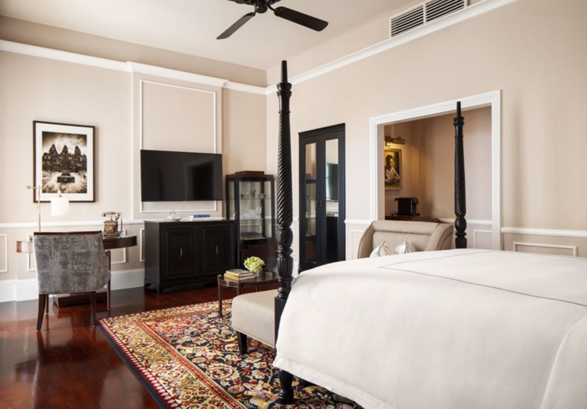 a room with a bed and a rug