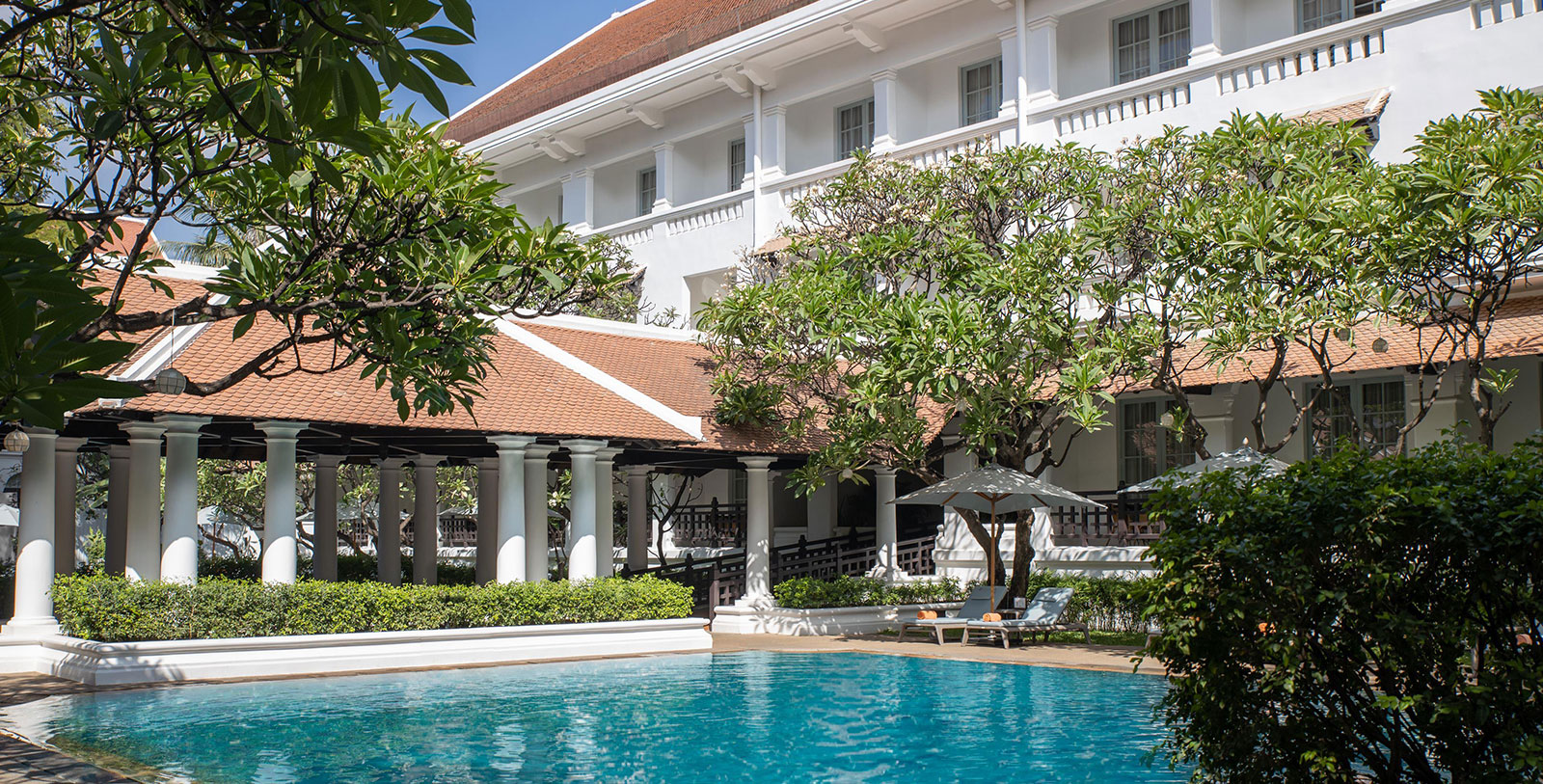 a pool in front of a building