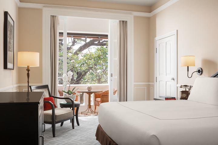 a bedroom with a bed and a chair