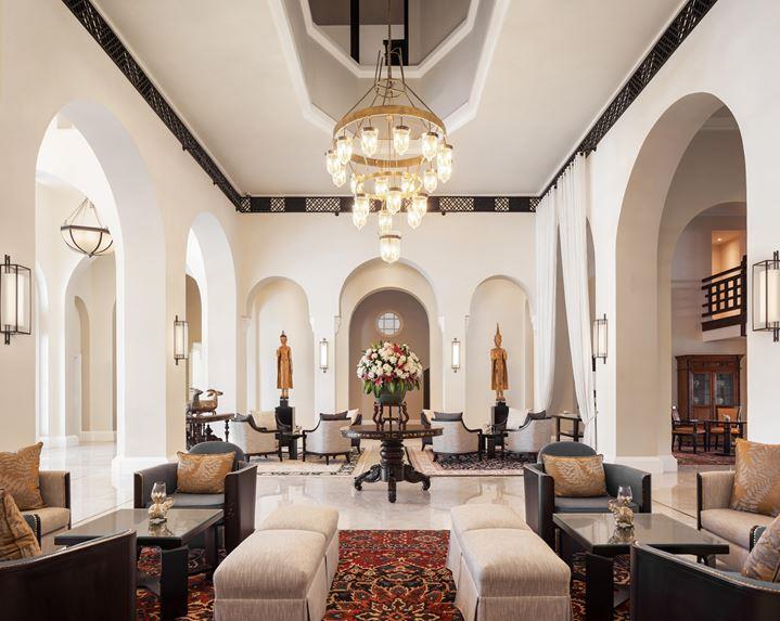 a room with a chandelier and tables
