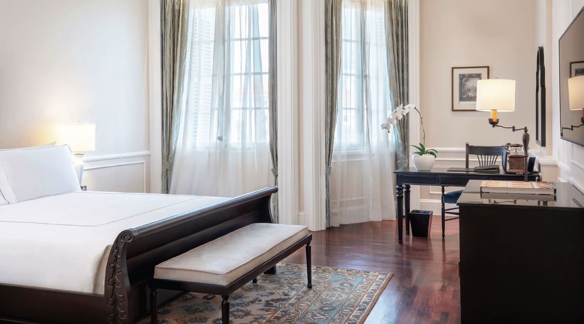 a room with a bed and a desk