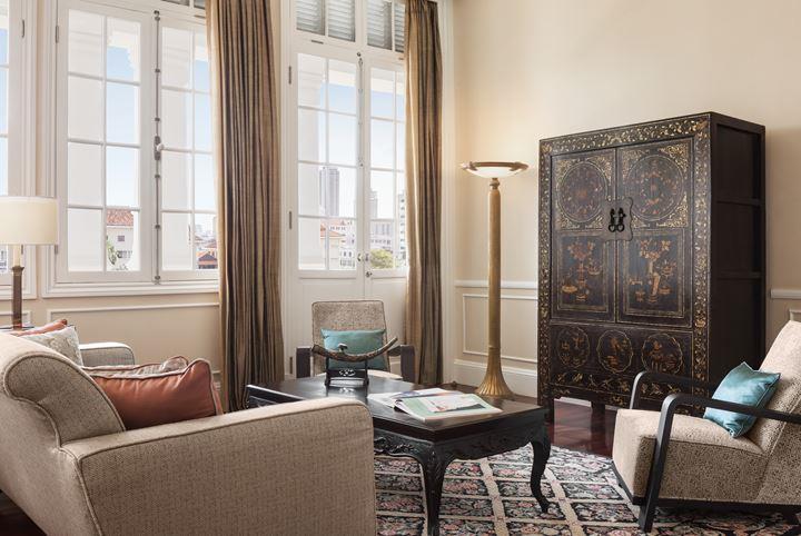 a living room with a large cabinet and couches