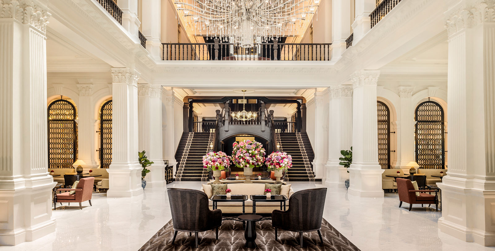 a large white building with a chandelier and a large chandelier